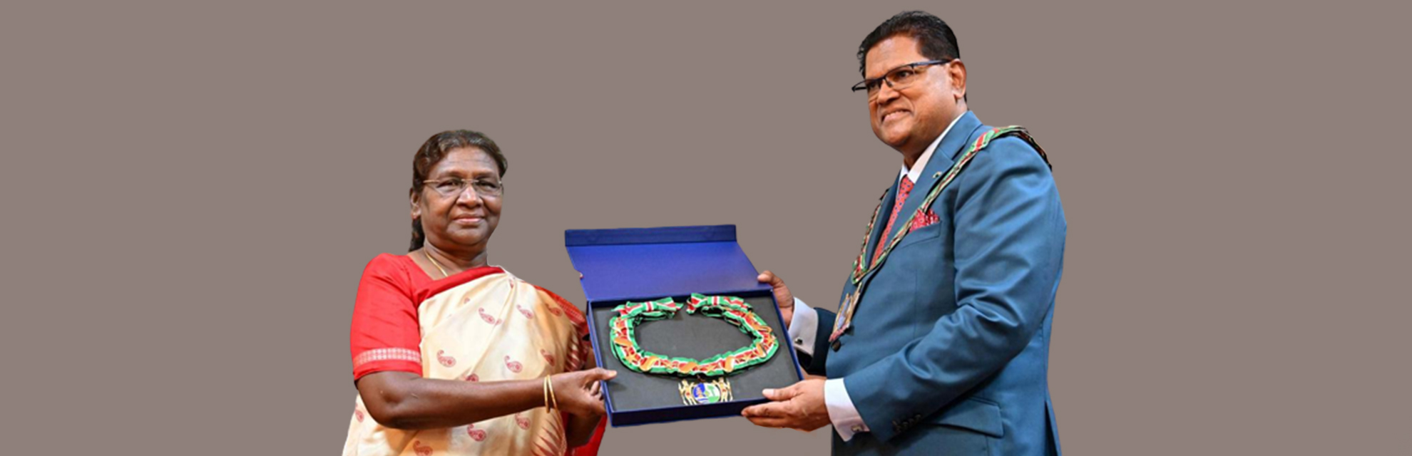 President Droupadi Murmu receiving Suriname’s highest distinction, “Grand Order of the Chain of the Yellow Star,” from Surinamese President Chandrikapersad Santokhi.