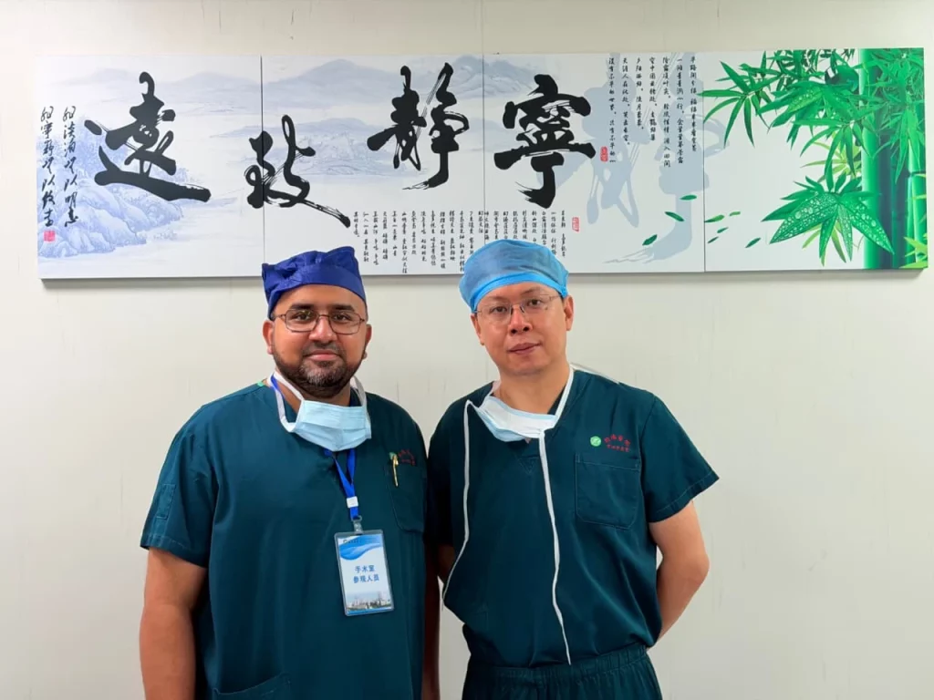 Dr Syed Mohammed Ghouse with a Chinese surgeon